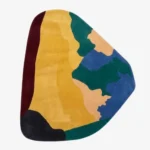 Laendra abstract shaped tufted area rug displayed flat on a clean background.