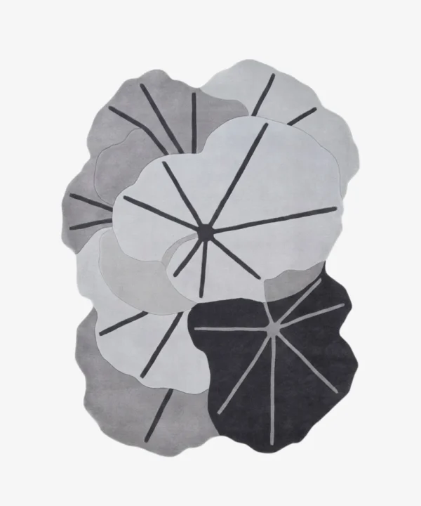 Full top-down product isolated shot of the custom-shaped Lotus Canopy area rug, featuring overlapping organic lotus leaf contours with prominent dark grey veining across a monochromatic palette of off-white, light grey, and charcoal.