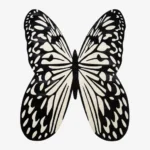 A top-down studio product photograph of the Monarch Noir area rug, featuring a striking, hand-tufted butterfly silhouette in high-contrast black and off-white.