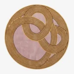 Naya round abstract tufted area rug featuring interconnected golden concentric line patterns on a muted pink background, displayed flat.