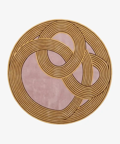 Naya round abstract tufted area rug featuring interconnected golden concentric line patterns on a muted pink background, displayed flat.