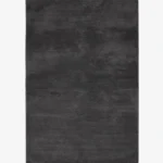 A top-down studio product photograph of a solid dark gray onyx area rug displayed against a neutral background.