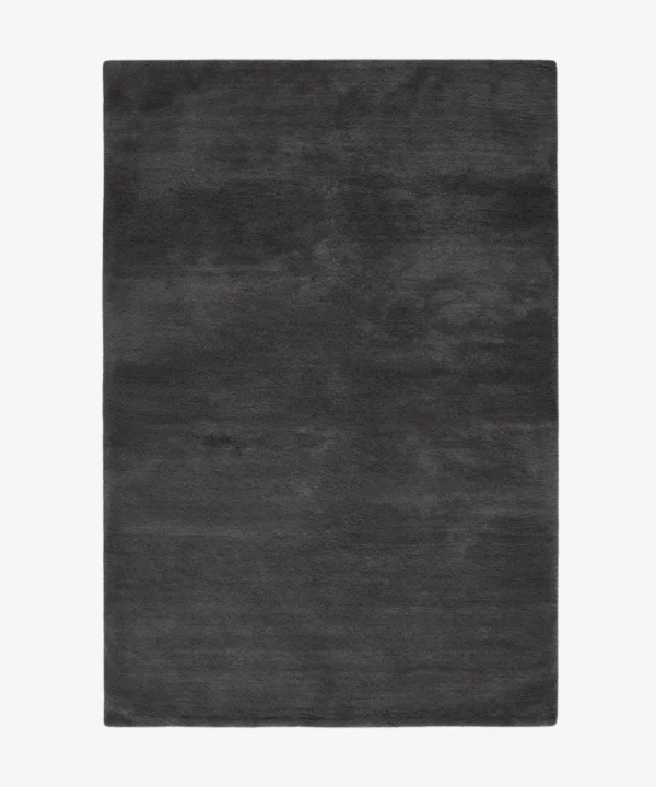 A top-down studio product photograph of a solid dark gray onyx area rug displayed against a neutral background.