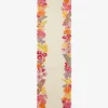 A full top-down studio product photograph of the Rosalia runner rug, featuring a creamy off-white base with intricate, vibrant, multi-colored floral borders.
