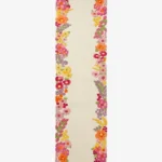A full top-down studio product photograph of the Rosalia runner rug, featuring a creamy off-white base with intricate, vibrant, multi-colored floral borders.