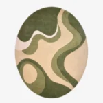 A top-down studio product photograph of the Sage Mevora oval area rug, featuring an abstract, organic pattern in layered shades of green, beige, and cream.