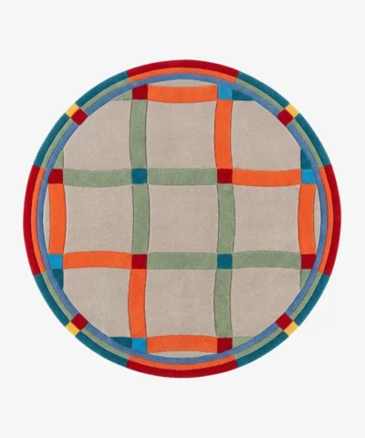 A top-down studio product photograph of the round Sage Plaidor area rug, featuring a neutral beige base with an intersecting grid pattern in vibrant orange, sage green, and blue, framed by a multi-colored circular border.