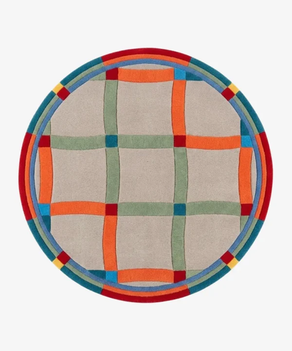 A top-down studio product photograph of the round Sage Plaidor area rug, featuring a neutral beige base with an intersecting grid pattern in vibrant orange, sage green, and blue, framed by a multi-colored circular border.
