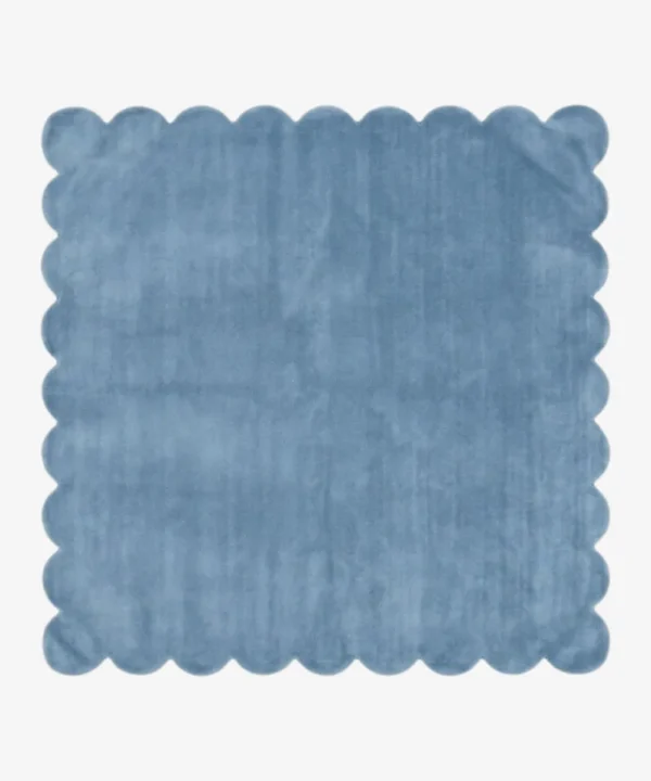 Skye Elara blue square area rug featuring a playful scalloped edge and plush tufted texture, displayed flat.