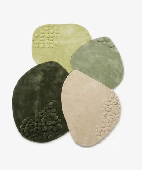 Full top-down product isolated shot of the custom-shaped Zen Pebble area rug, featuring overlapping organic stone contours with raised bubble clusters in an earth-toned palette of forest green, sage, lime, and sand beige.
