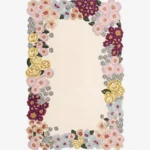 Flat-lay top view of the Bloomara designer floral border rug showcasing its rectangular shape and intricate colorful blossom patterns.