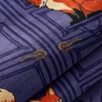 Close-up of the plush tufted pile texture, detailed door panel carving, and vibrant fox illustrations on the Foxmere rug.