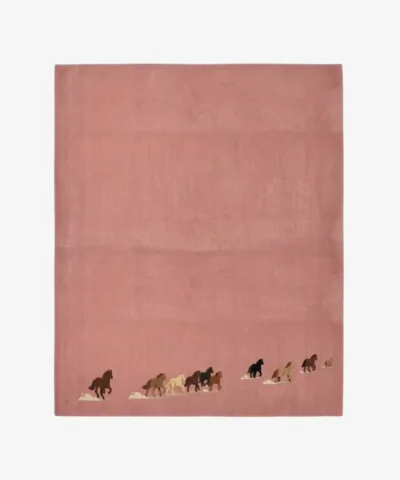 Petite Caravan pink rectangular tufted area rug featuring a charming running horse border motif, displayed flat.
