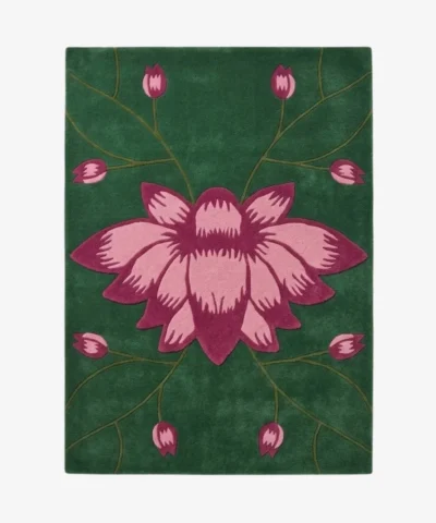 Flat-lay top view of the Poppy handmade tufted area rug featuring a large pink flower motif and botanical vine details on a rich green background.