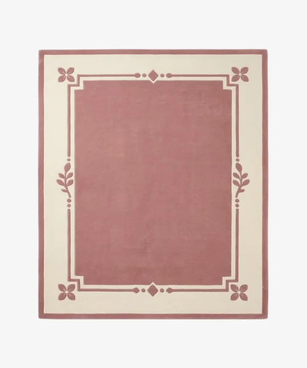 Rosaine pink and cream rectangular area rug featuring an elegant bordered geometric and floral corner design, displayed flat.
