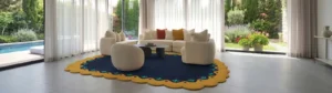 25 Irregular Shaped Rugs handmade tufted area rug featuring a deep blue center with a scalloped yellow and teal floral border, styled in a luxurious modern living room with large glass windows overlooking a pool and garden.
