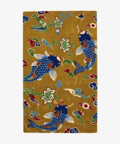 Koi Haven handmade tufted area rug featuring a golden-yellow background with traditional blue koi fish, floral motifs, and cloud patterns displayed flat.
