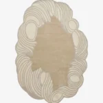 Flat-lay top view of the Tidewave designer wavy border rug showcasing its abstract shape and neutral earth tones.