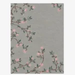Studio flat-lay product photograph of the rectangular Sakura Branch rug on a clean background, showcasing the full sage-grey field with branching floral patterns.