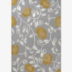 Studio flat-lay product photograph of the rectangular Twine rug on a clean background, showcasing the grey wool field patterned with flowing white botanical vines and mustard-gold floral blooms.
